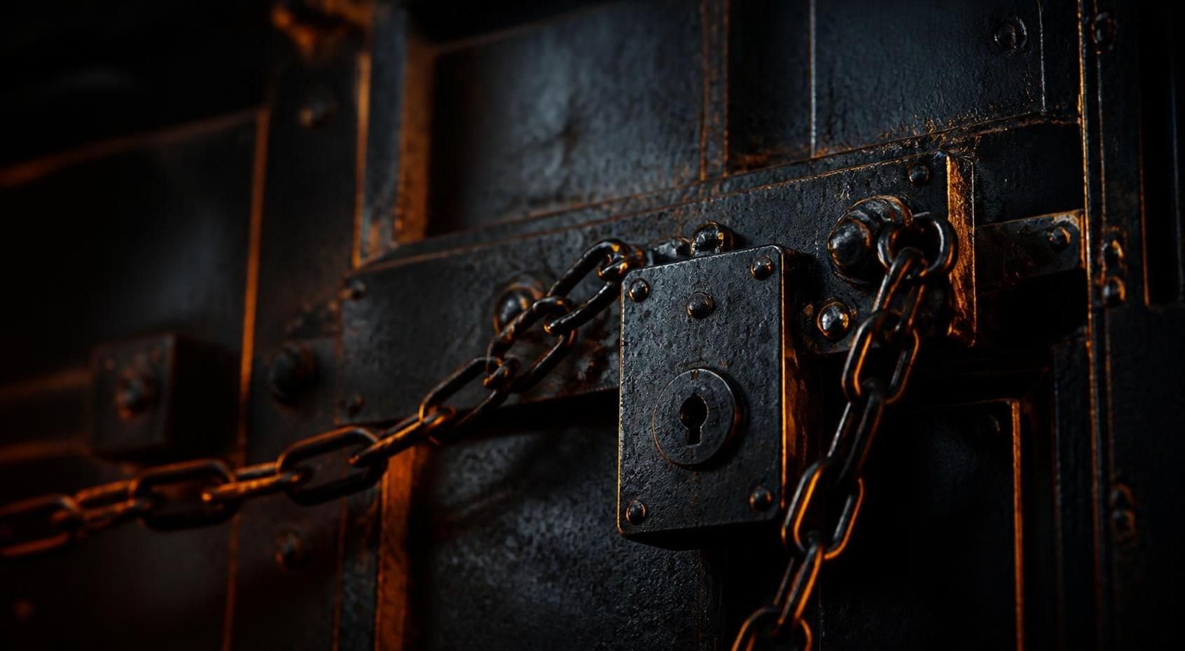 Padlocks and chain on a dark background